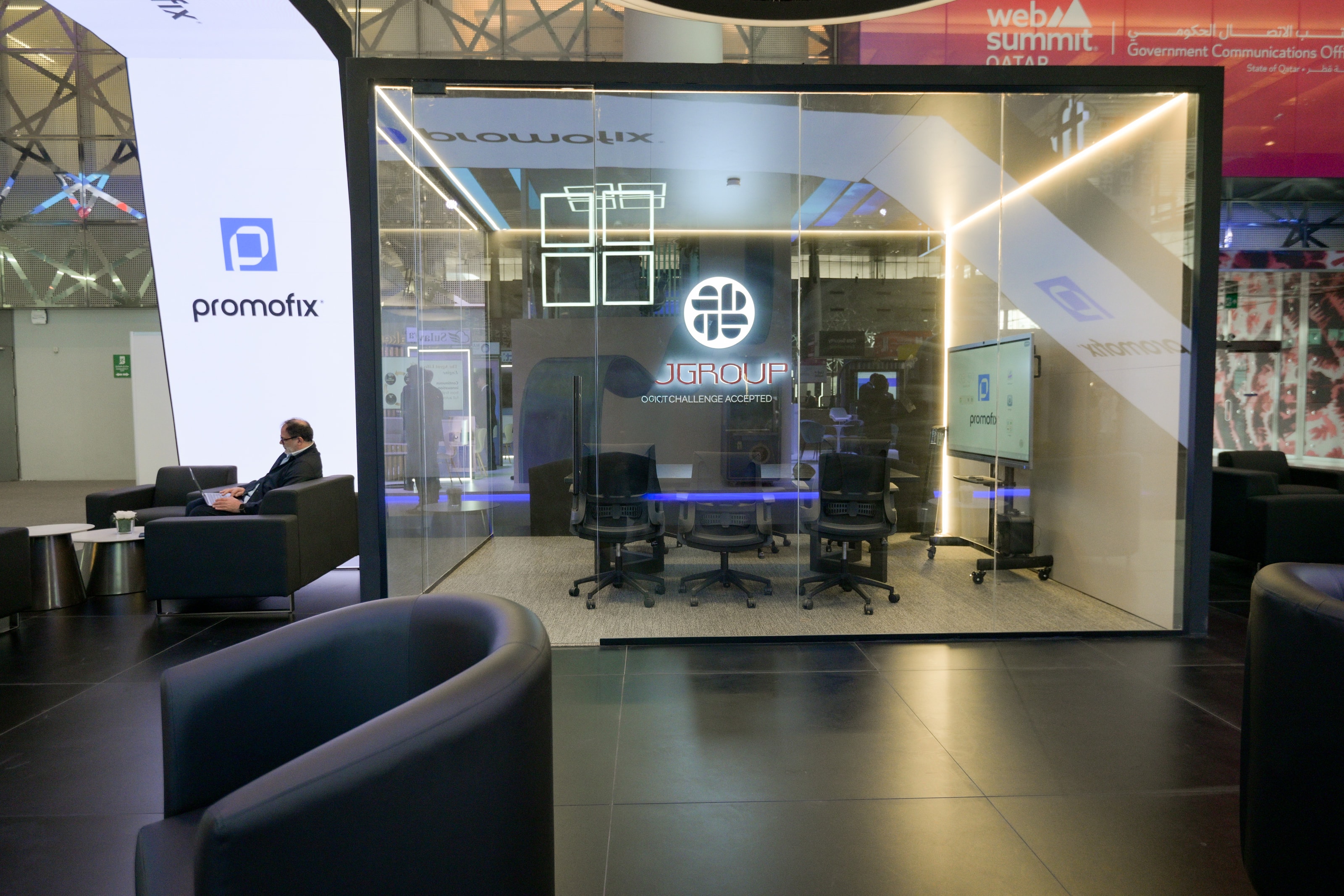 Glass meeting room built into the J Group booth